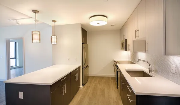 a kitchen that has a sink and a stove