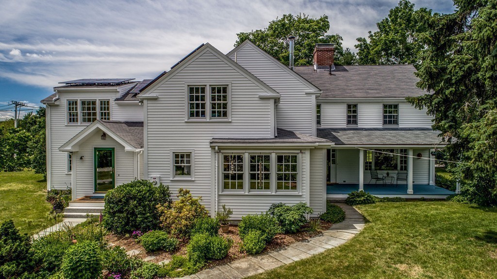 23 Slough Road Harvard, MA 01451 - Photo 1 of 30 a front view of a house with a yard and porch