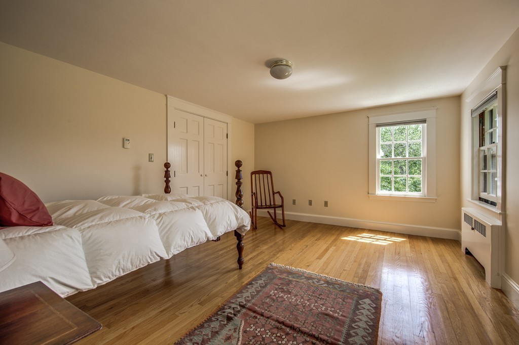 23 Slough Road Harvard, MA 01451 - Photo 27 of 30 a spacious bedroom with a bed and a window