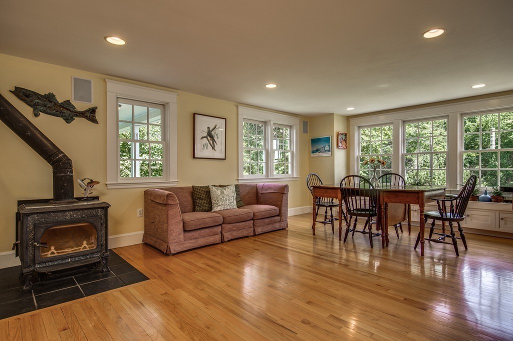 23 Slough Road Harvard, MA 01451 - Photo 6 of 30 a living room with furniture and a fireplace