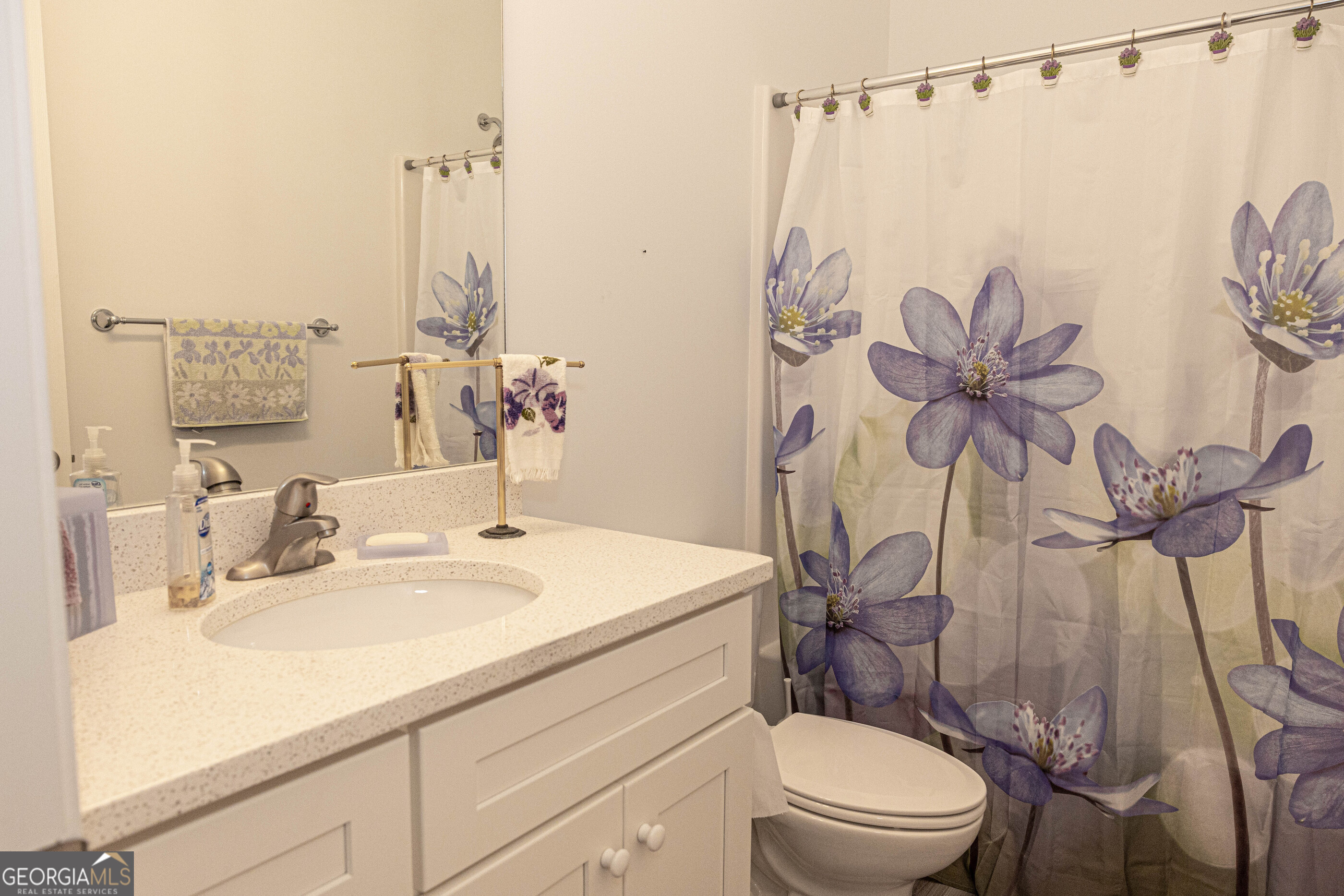 3508 23rd Drive Valley, AL 36854 - Photo 12 of 23 a bathroom with a sink a toilet and a mirror