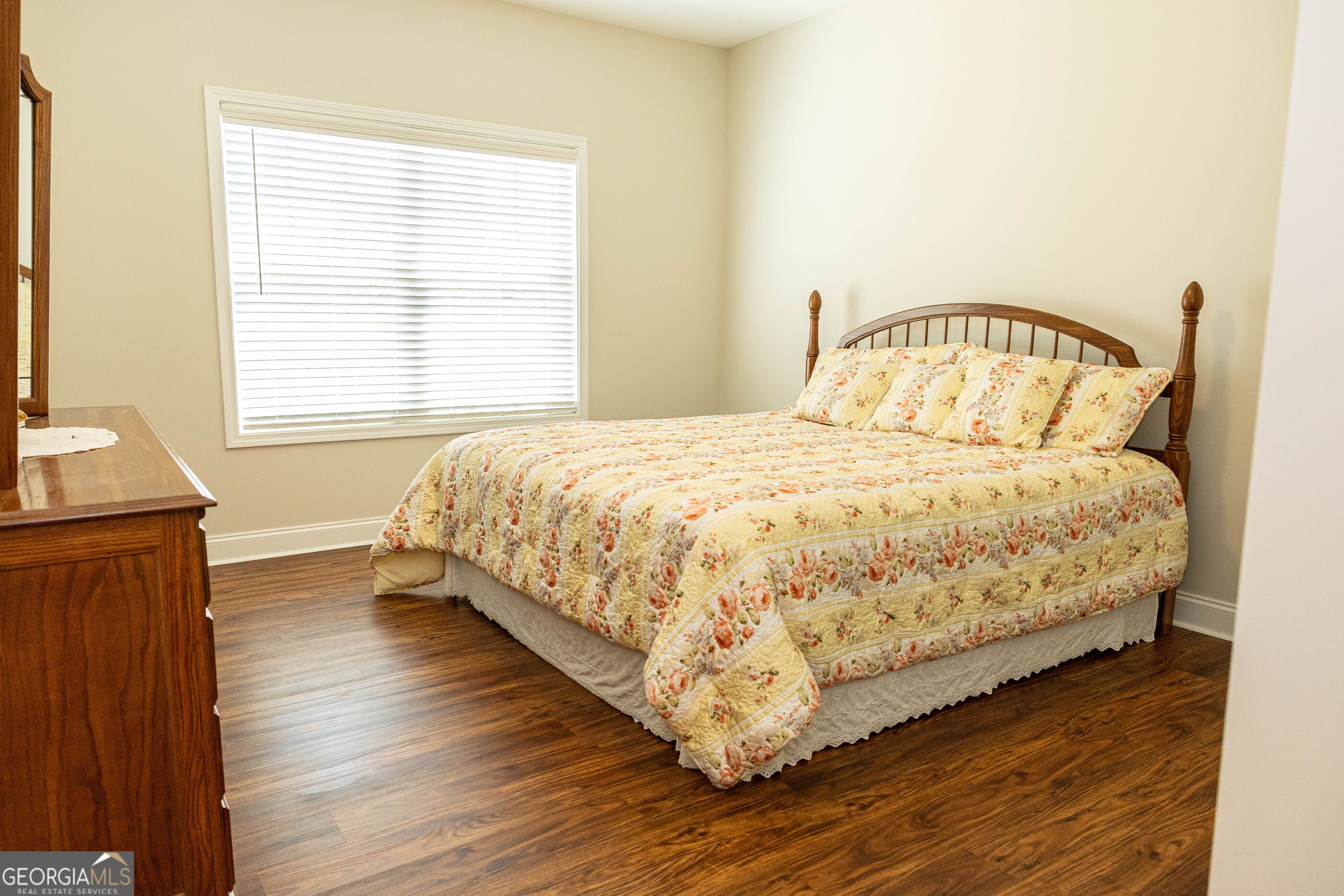 3508 23rd Drive Valley, AL 36854 - Photo 14 of 23 a bedroom with a bed and wooden floor