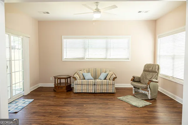a living room with furniture and a window
