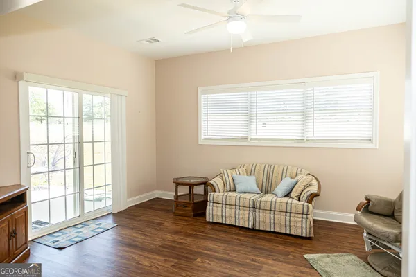 a living room with furniture and a window