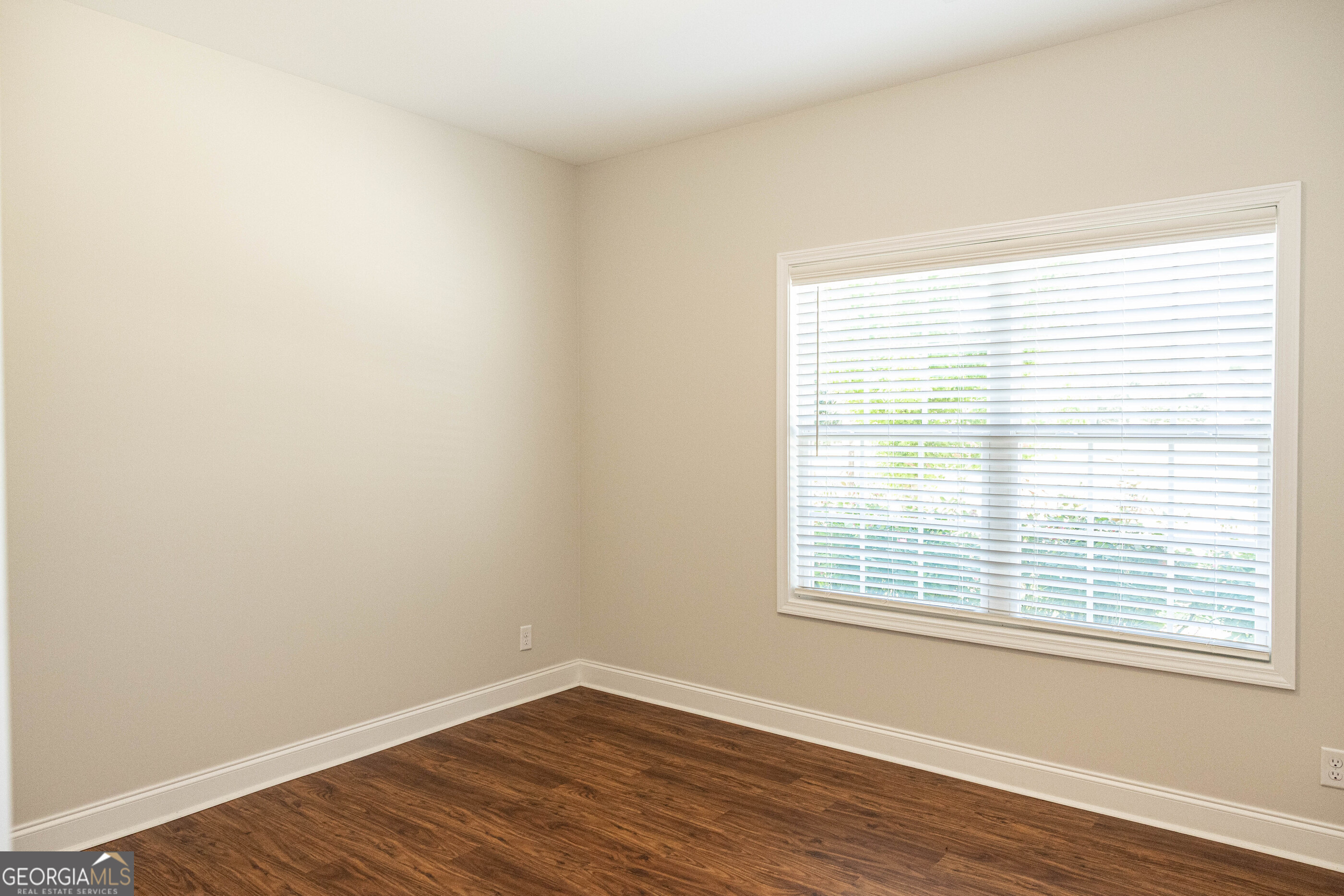 3508 23rd Drive Valley, AL 36854 - Photo 10 of 23 wooden floor in an empty room with a window