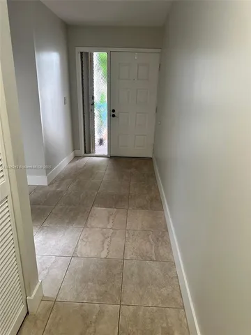 a view of hallway with a window