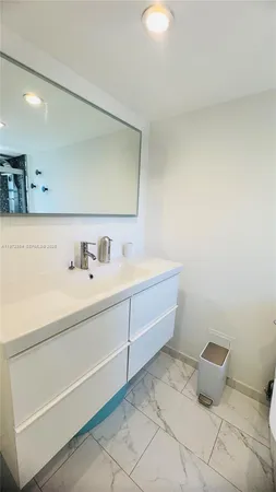 a bathroom with a sink and a toilet