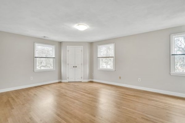 71 Smith Street Wellesley, MA 02482 - Photo 11 of 25 a view of an empty room with wooden floor and a window
