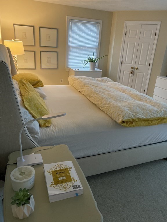 71 Smith Street Wellesley, MA 02482 - Photo 13 of 25 a bedroom with a bed and window