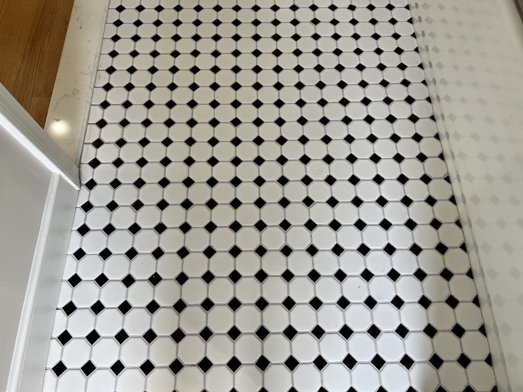 71 Smith Street Wellesley, MA 02482 - Photo 16 of 25 a bathroom with a black and white checkered and white bathroom