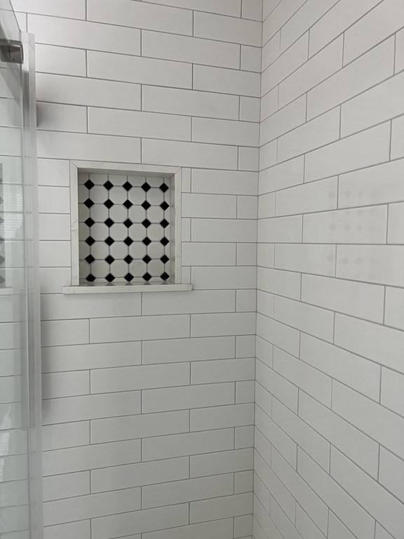 71 Smith Street Wellesley, MA 02482 - Photo 17 of 25 a bathroom with a shower