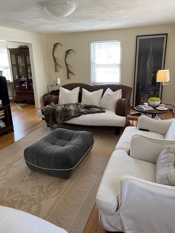 71 Smith Street Wellesley, MA 02482 - Photo 5 of 25 a living room with furniture and a window