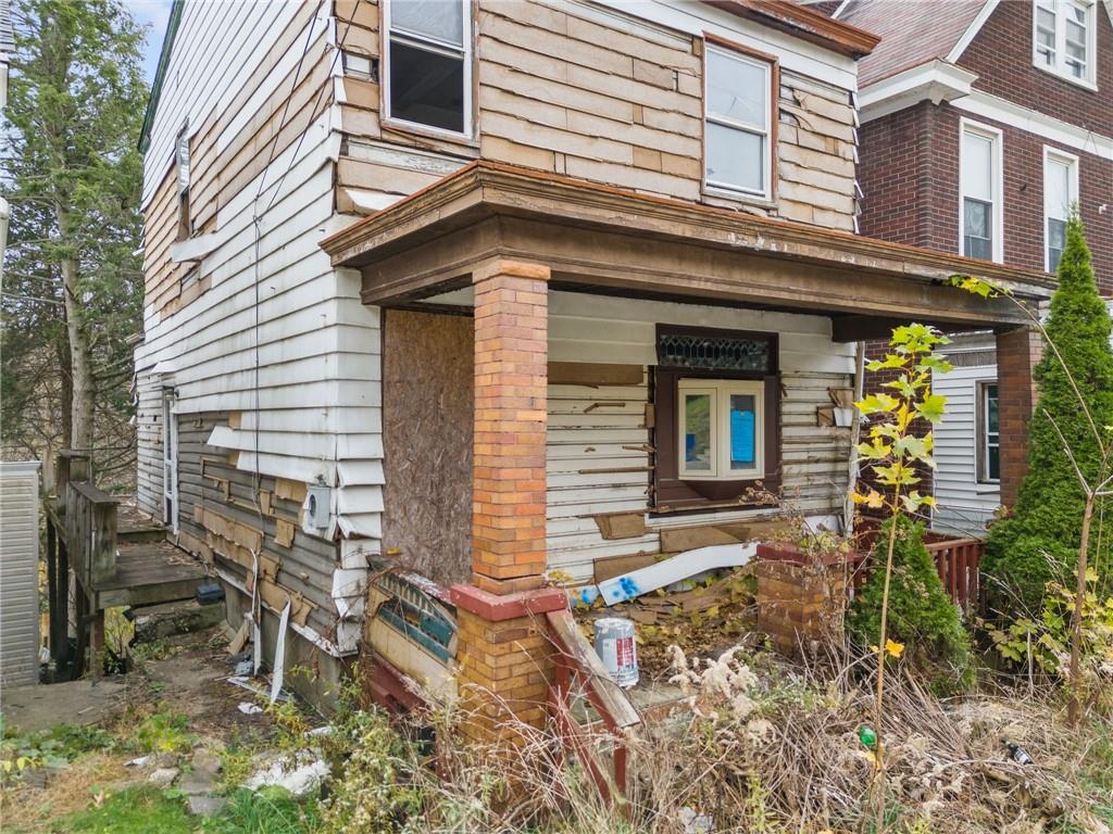 206 Alries Street Pittsburgh, PA 15210 - Photo 2 of 8 a view of house with patio outdoor seating area