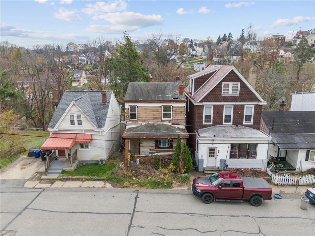 206 Alries Street Pittsburgh, PA 15210 - Photo 6 of 8 a front view of a house with a garden