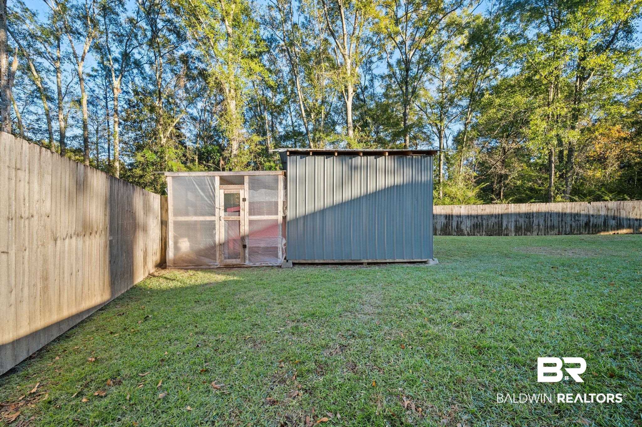9366 Fox Run Court Semmes, AL 36575 - Photo 27 of 29 View of yard with an outbuilding