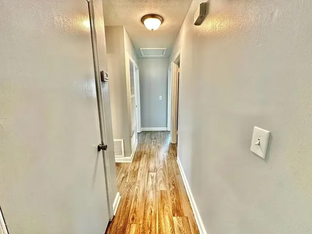 a view of a bathroom with a sink and a mirror