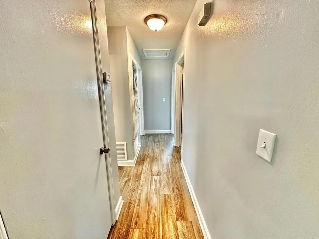 2928 Luckie Street Columbus, GA 31903 - Photo 11 of 32 a view of a bathroom with a sink and a mirror