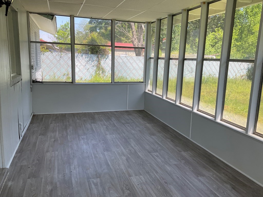 2928 Luckie Street Columbus, GA 31903 - Photo 28 of 32 a view of an empty room with wooden floor and a window