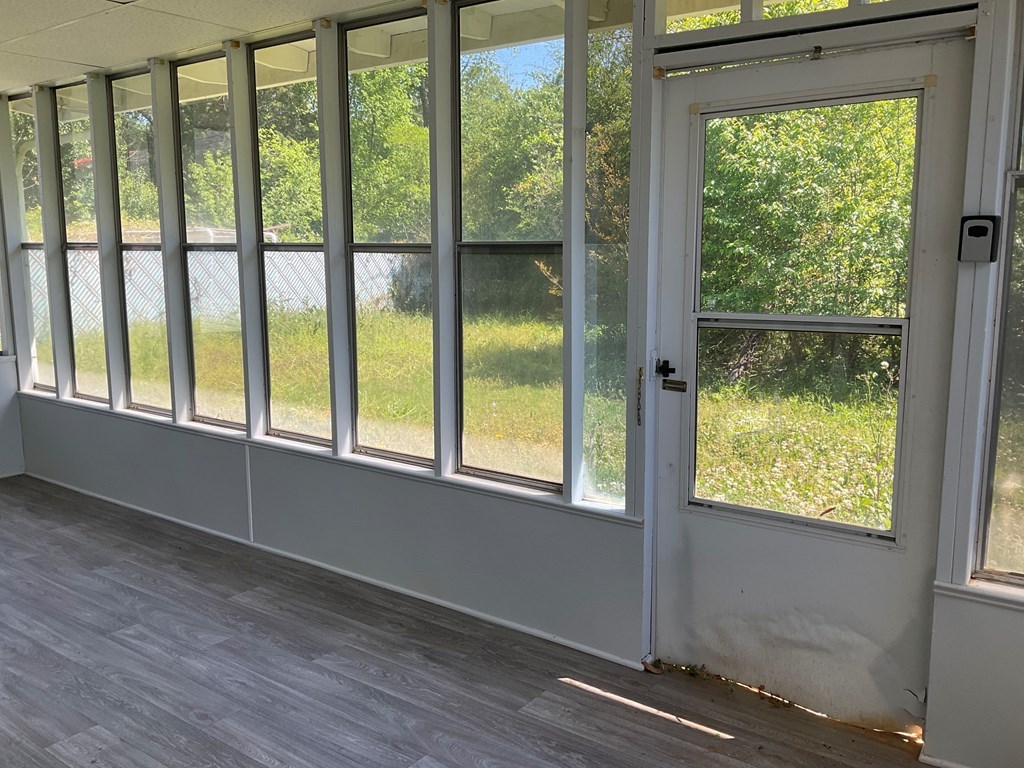 2928 Luckie Street Columbus, GA 31903 - Photo 29 of 32 a view of an empty room with wooden floor and windows