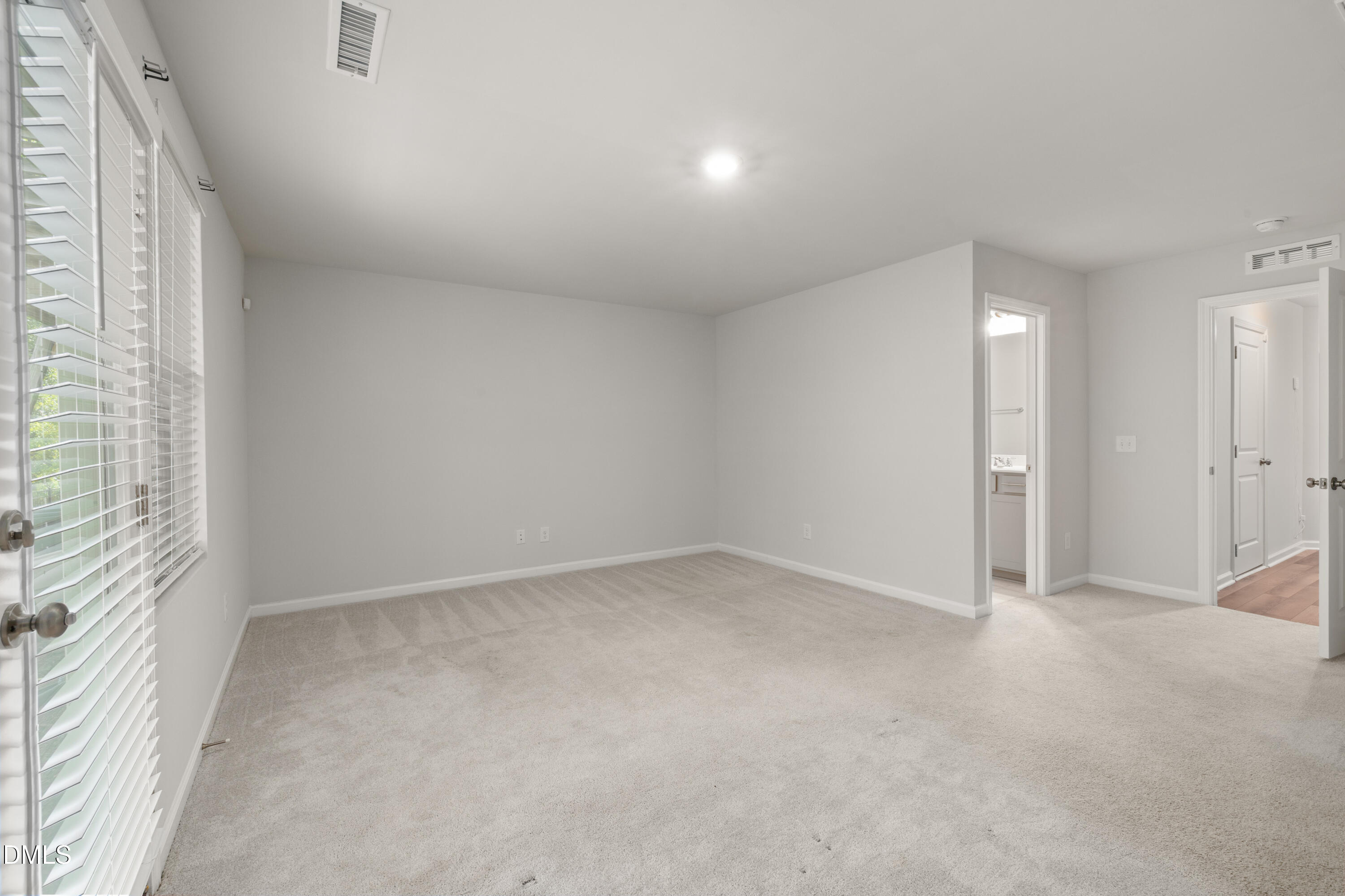 2524 Laurel Valley Way Raleigh, NC 27604 - Photo 8 of 12 an empty room with a empty space and windows