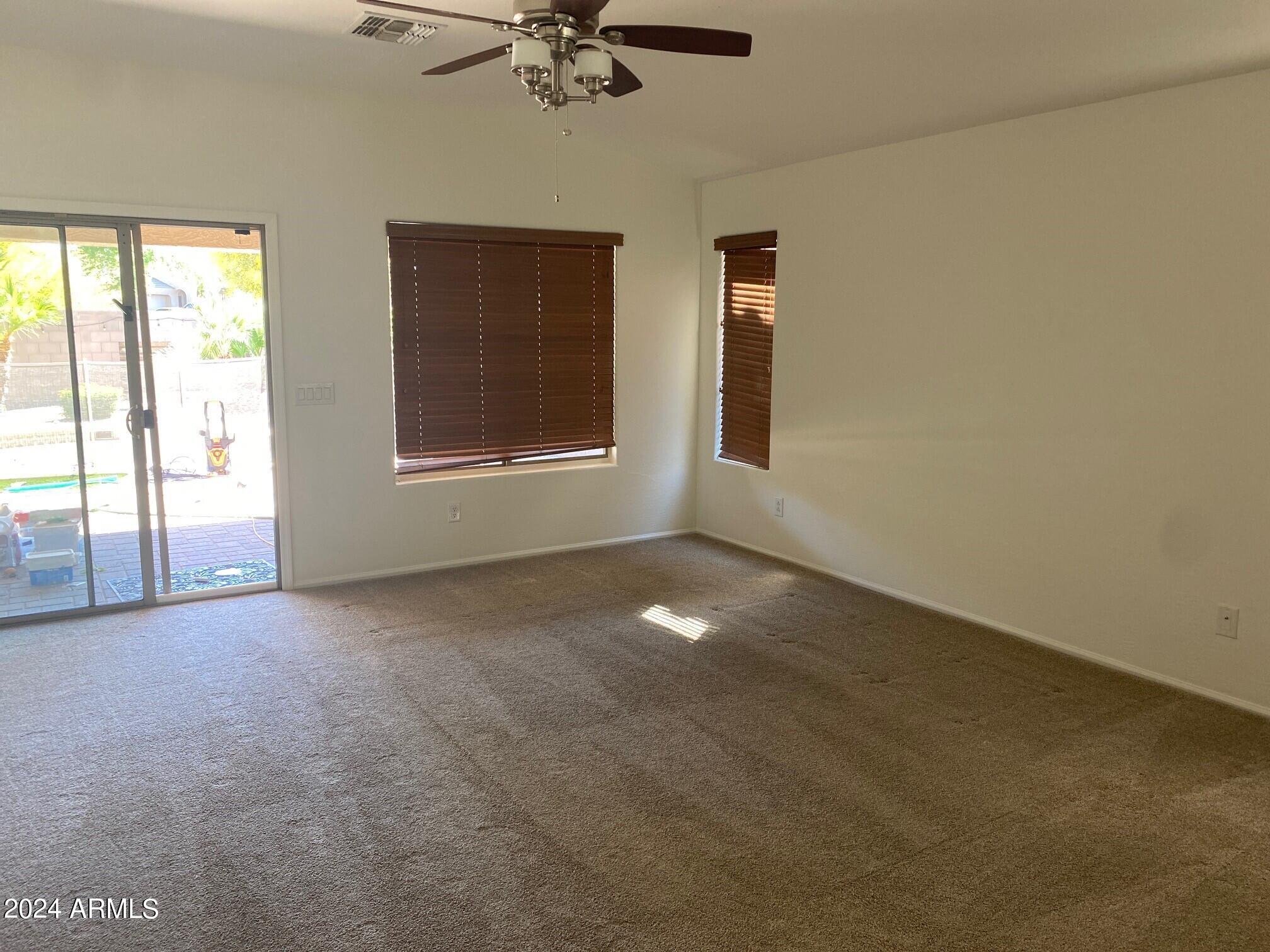 2812 East Questa Drive Phoenix, AZ 85024 - Photo 11 of 32 a view of a livingroom with a ceiling fan and window