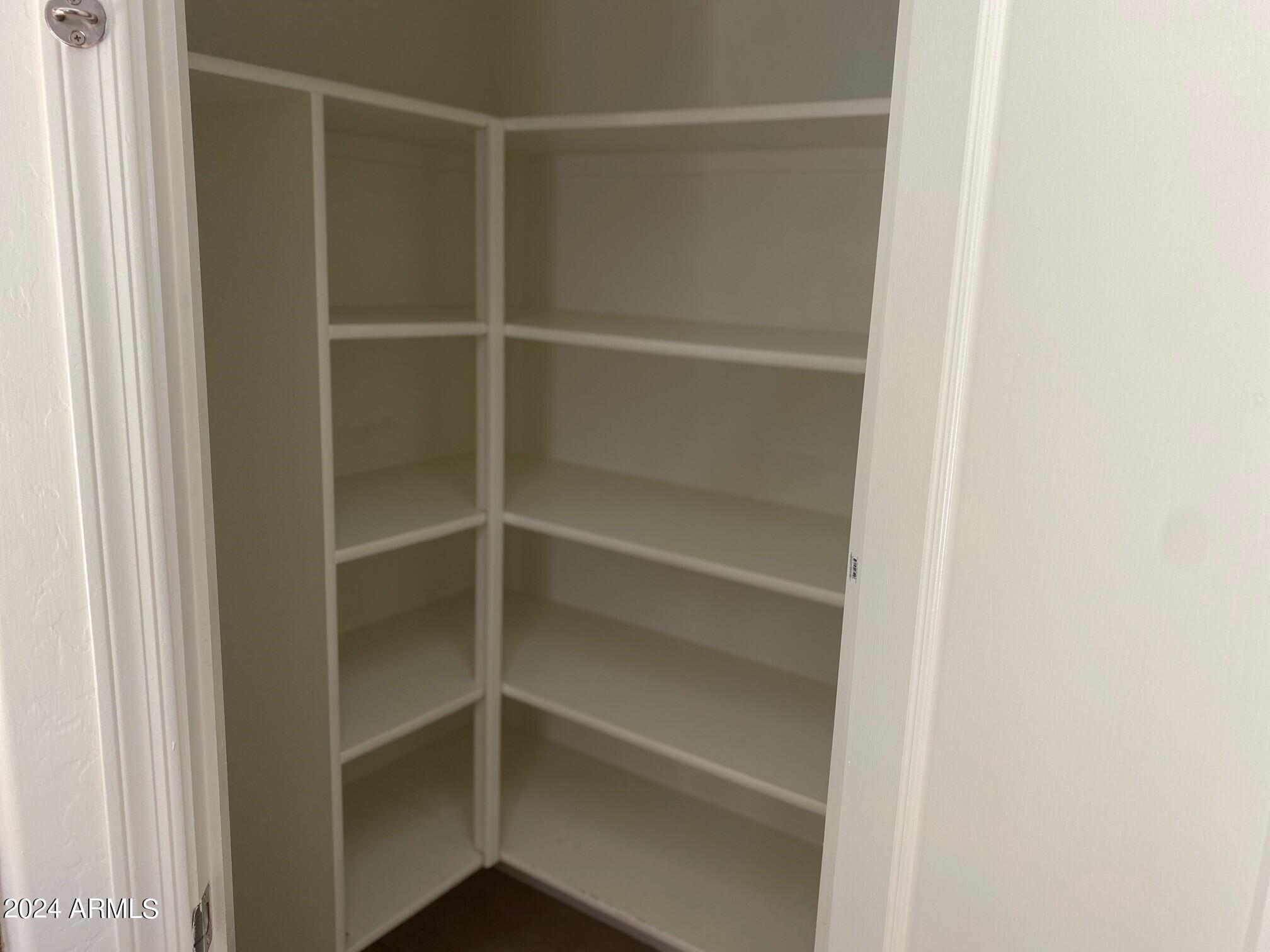 2812 East Questa Drive Phoenix, AZ 85024 - Photo 12 of 32 a view of walk in closet with empty racks