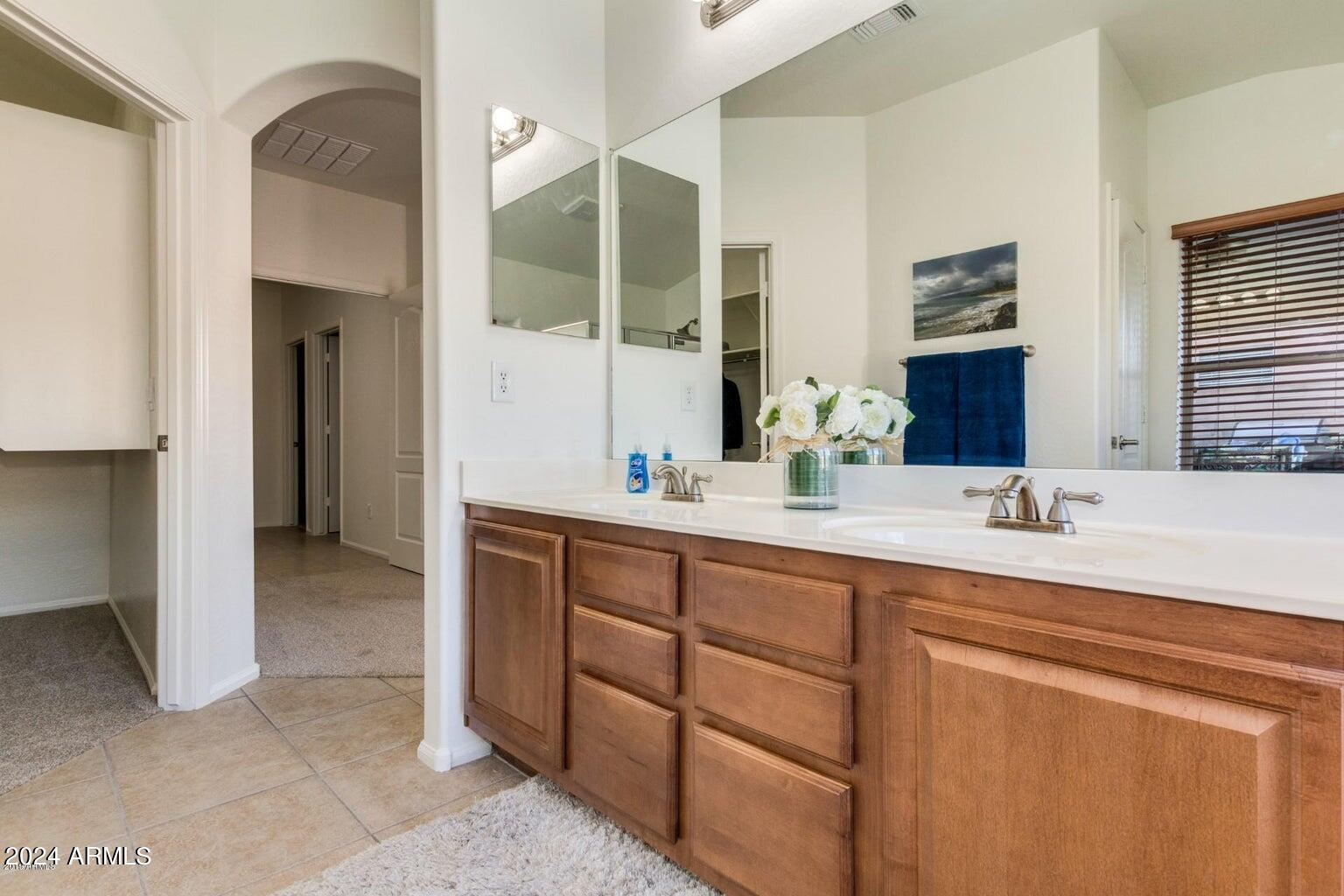 2812 East Questa Drive Phoenix, AZ 85024 - Photo 19 of 32 a bathroom with a double vanity sink and a mirror