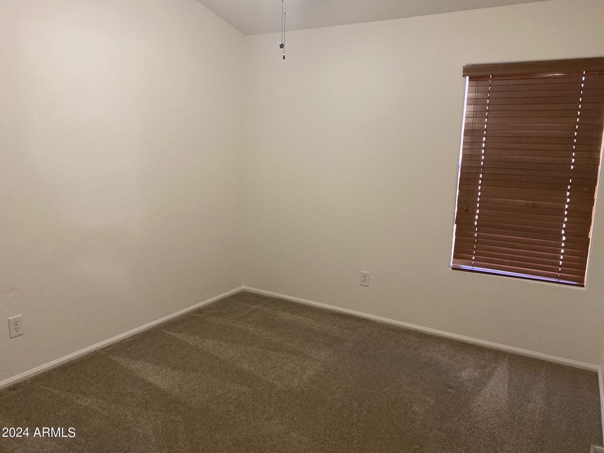 2812 East Questa Drive Phoenix, AZ 85024 - Photo 20 of 32 a view of an empty room with a window