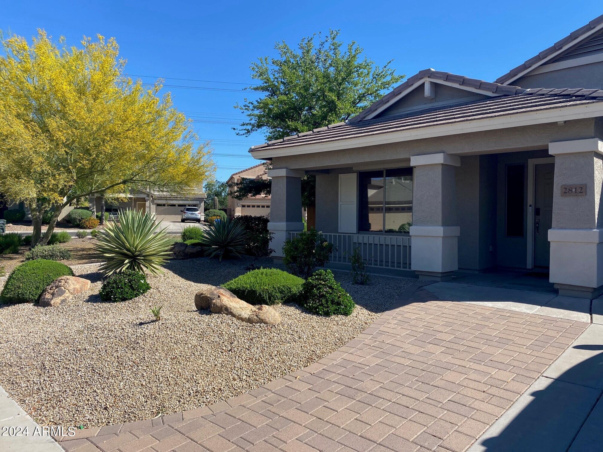 2812 East Questa Drive Phoenix, AZ 85024 - Photo 2 of 32 a front view of a house with a yard