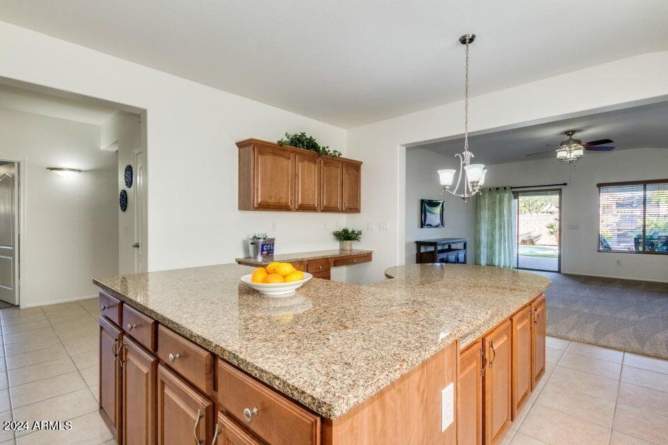 2812 East Questa Drive Phoenix, AZ 85024 - Photo 7 of 32 a kitchen with granite countertop kitchen island sink and stainless steel appliances