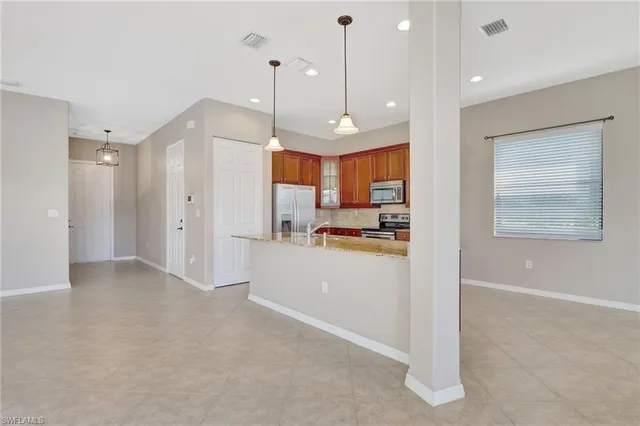 a view of a kitchen and window