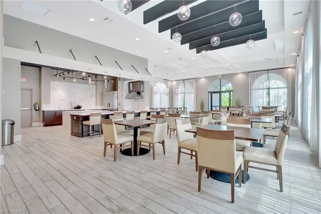 a large room with lots of furniture and windows