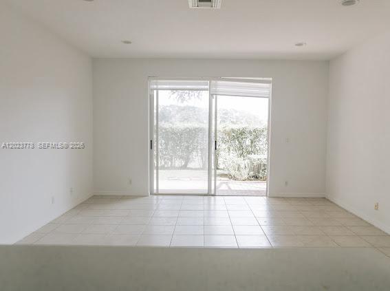 10245 Vía Hibiscus, Unit 10245 Boca Raton, FL 33428 - Photo 4 of 28 a view of an empty room with a window