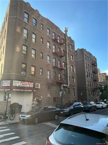a view of a building and car parked