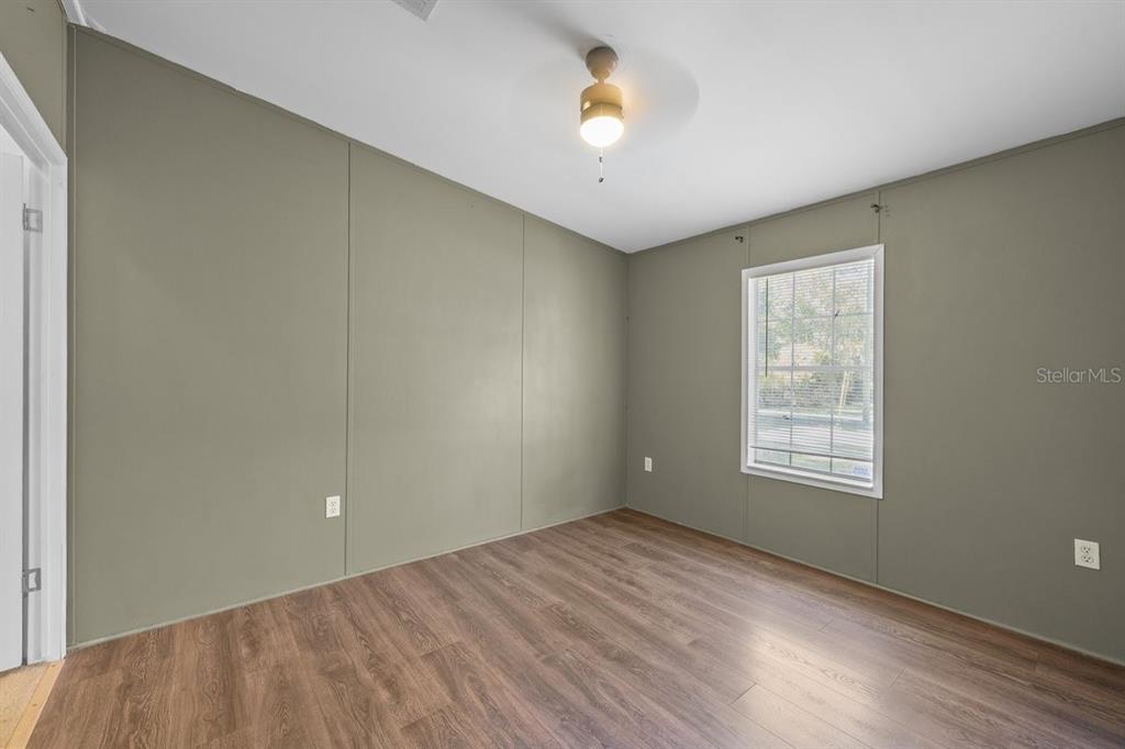 218 Northeast 132nd Terrace Gainesville, FL 32641 - Photo 11 of 40 a view of an empty room with a window