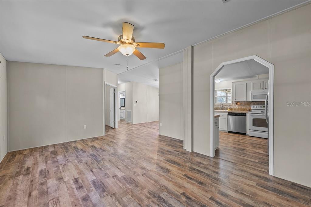 218 Northeast 132nd Terrace Gainesville, FL 32641 - Photo 14 of 40 a view of a kitchen with a sink and a refrigerator