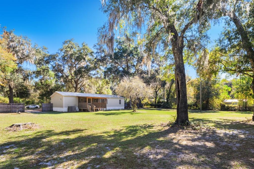 218 Northeast 132nd Terrace Gainesville, FL 32641 - Photo 30 of 40 a view of a house with yard and tree