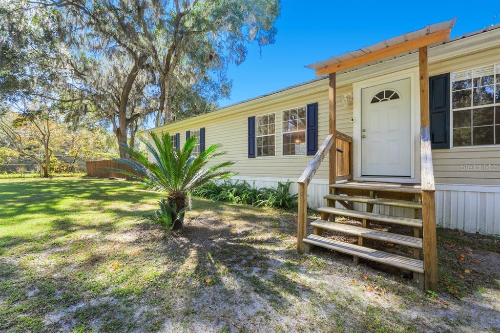 218 Northeast 132nd Terrace Gainesville, FL 32641 - Photo 3 of 40 a view of a house with a yard