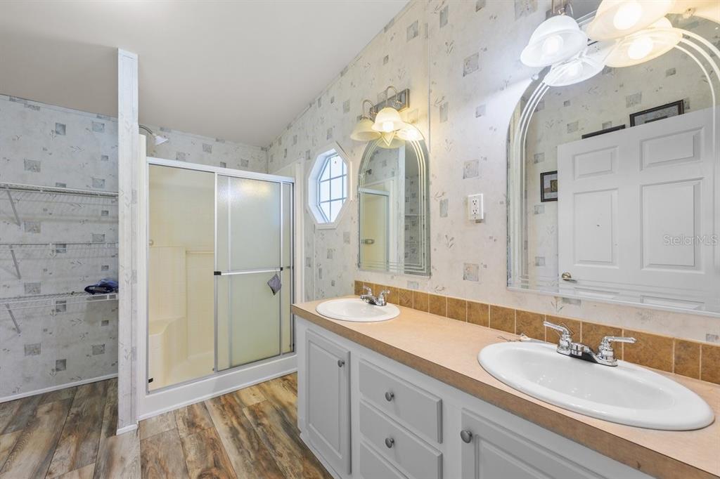 218 Northeast 132nd Terrace Gainesville, FL 32641 - Photo 7 of 40 a spacious bathroom with a double vanity sink mirror and double