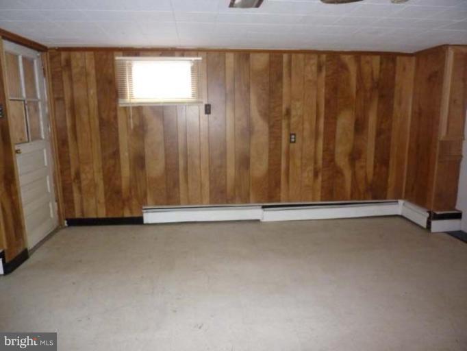 104 Poplar Road Riva, MD 21140 - Photo 8 of 13 a view of an empty room with a wooden door