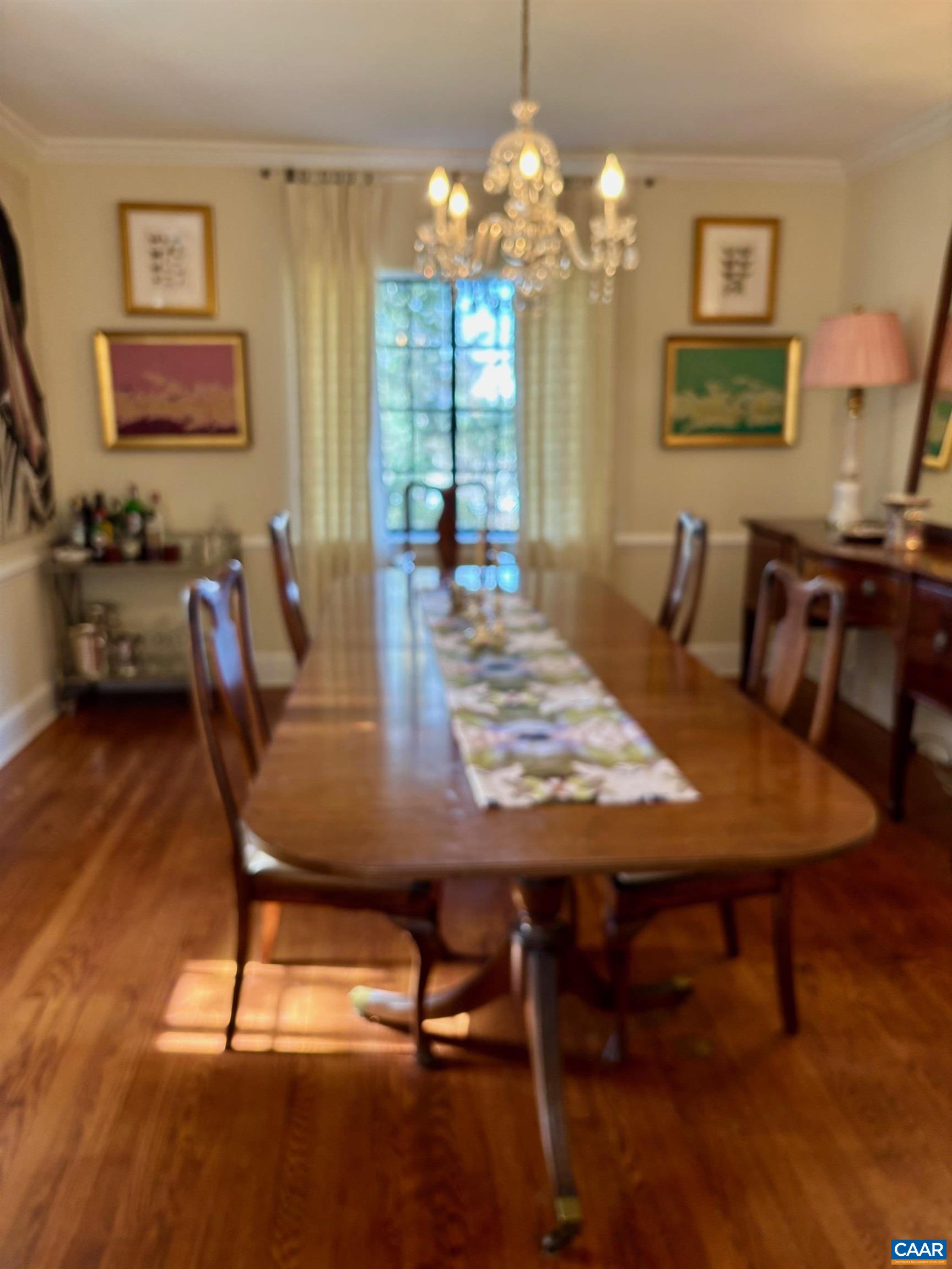 1879 Wayside Place Charlottesville, VA 22903 - Photo 3 of 13 a view of a dining room with furniture and chandelier