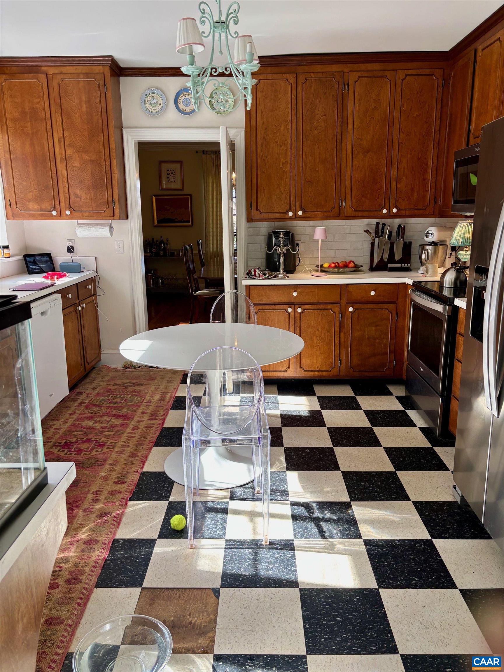 1879 Wayside Place Charlottesville, VA 22903 - Photo 7 of 13 a kitchen with a sink a stove a refrigerator and cabinets