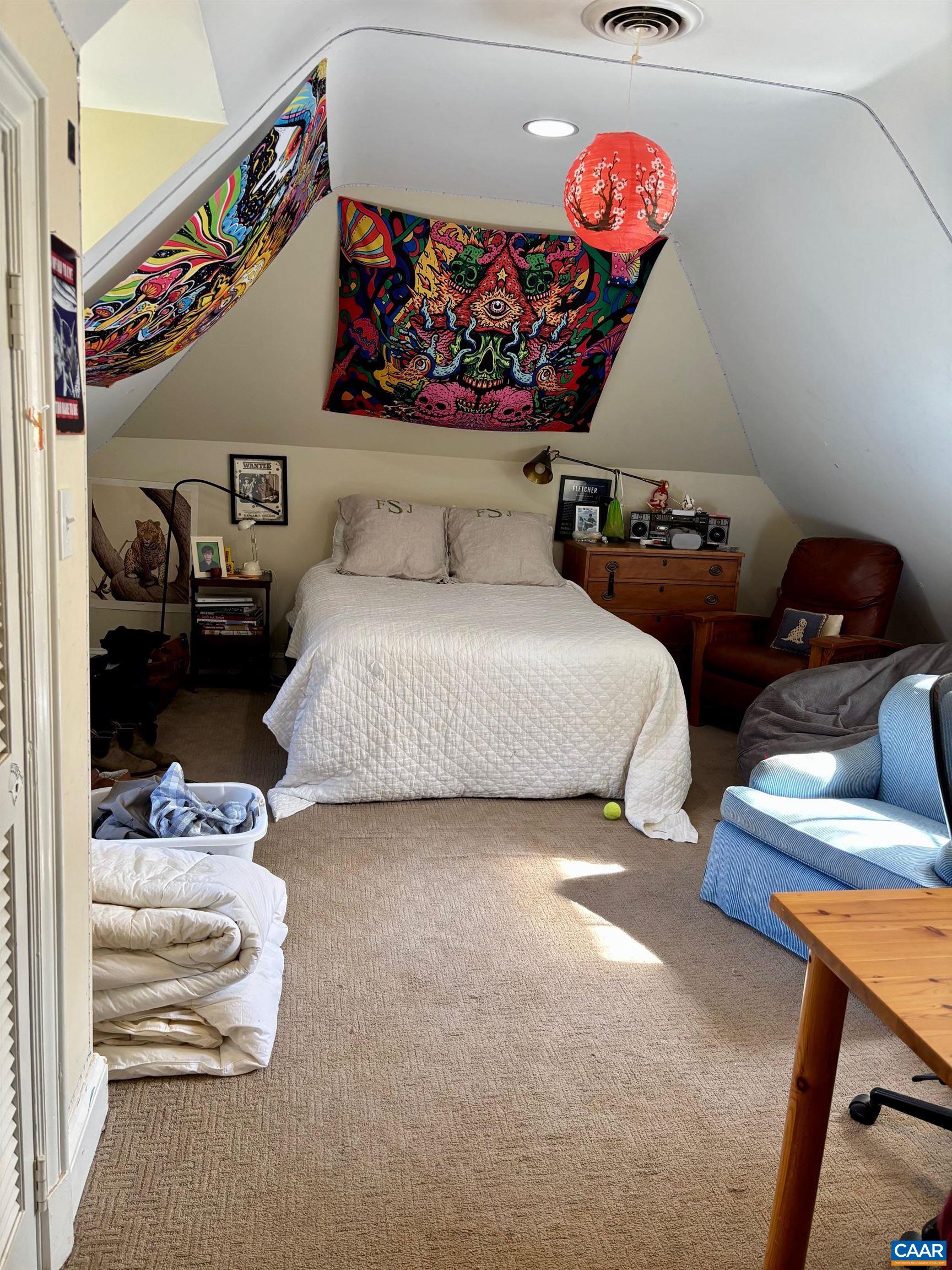 1879 Wayside Place Charlottesville, VA 22903 - Photo 10 of 13 a bedroom with furniture and a chandelier