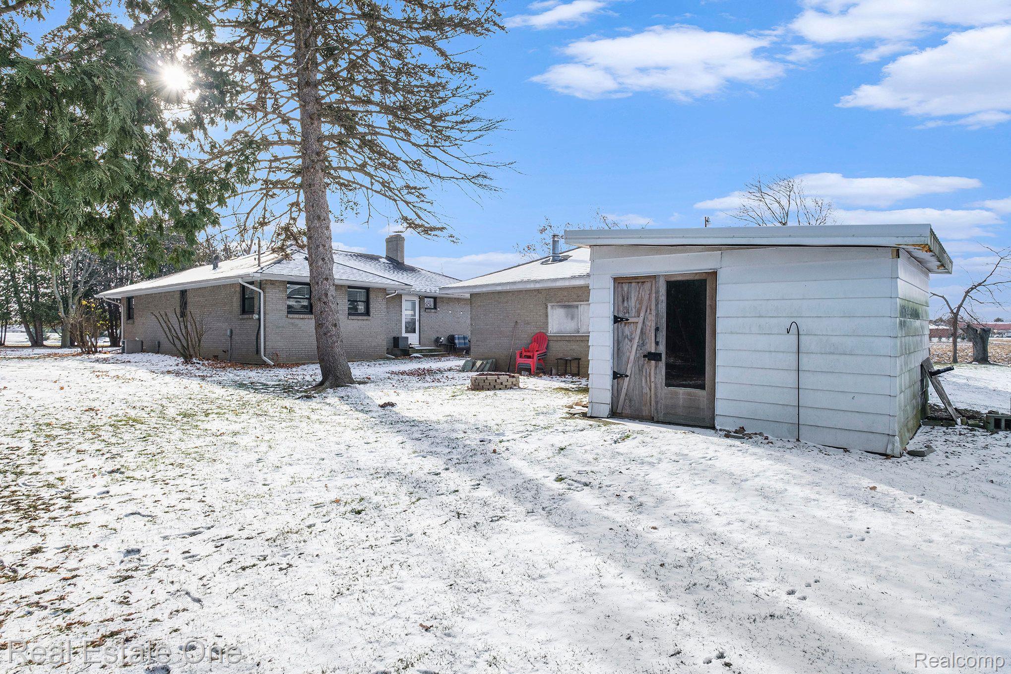 6011 Perry Road Grand Blanc, MI 48439 - Photo 15 of 20 2 car garage + sheds