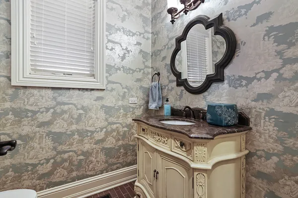 a spacious bathroom with a tub and a large window