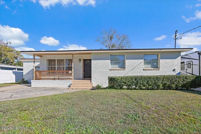 front view of a house with a yard