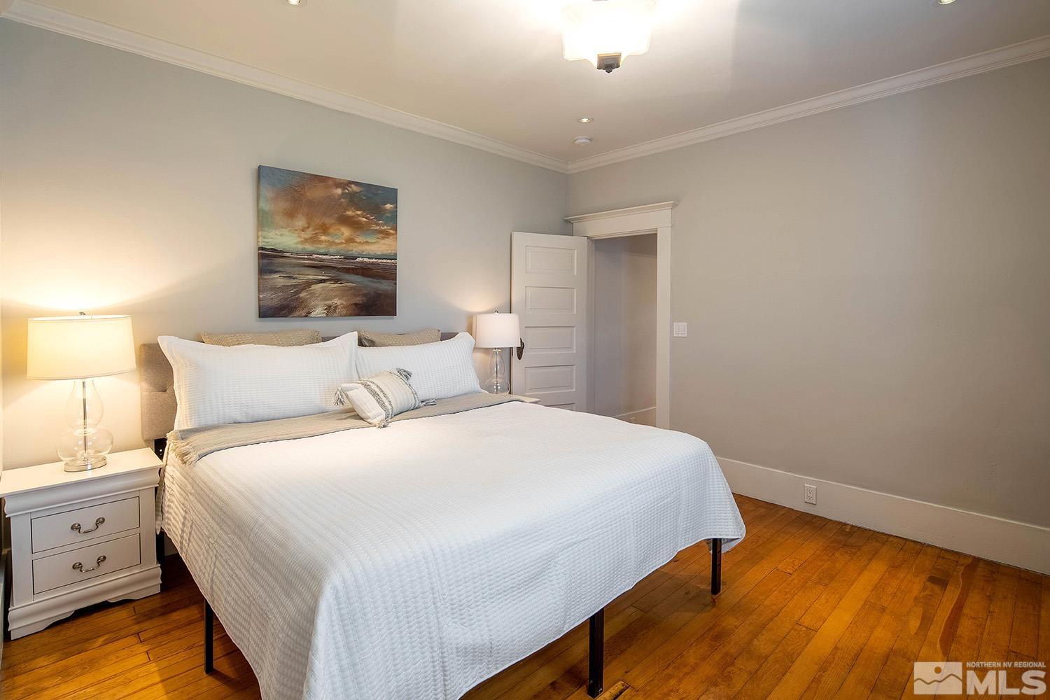 742 Plumas Street Reno, NV 89509 - Photo 25 of 40 a bedroom with a bed and a night stand