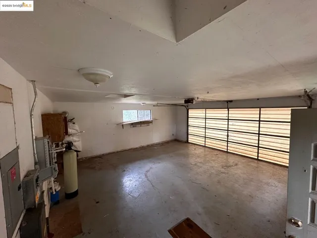 a view of a livingroom with furniture and a window