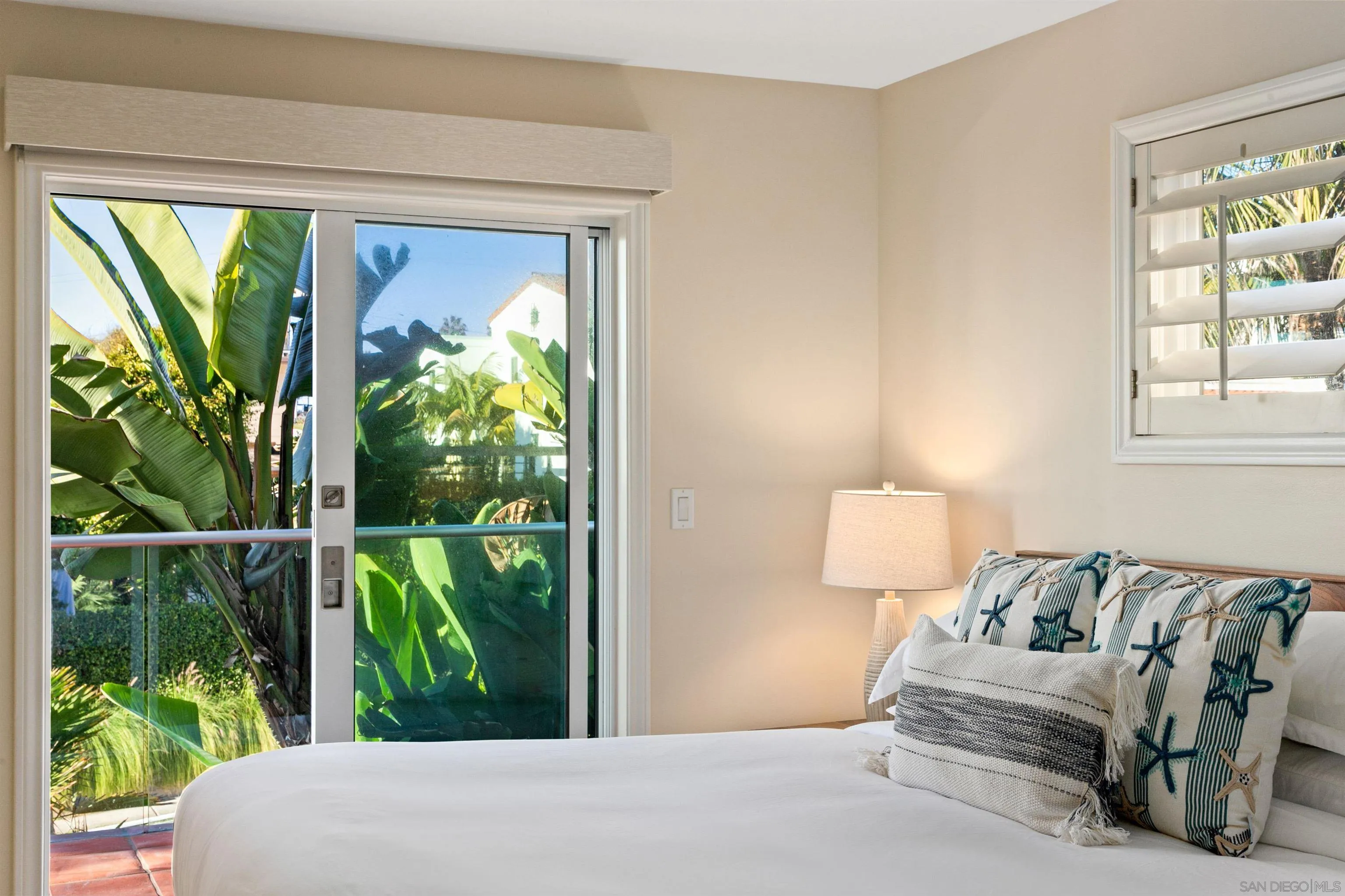 253 Gravilla Street La Jolla, CA 92037 - Photo 14 of 34 a bedroom with furniture and a window