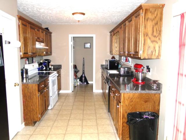 301 Webb Road Bell Buckle, TN 37020 - Photo 6 of 18 Kitchen with utility room at the end.